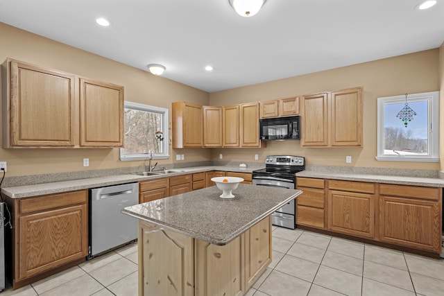 3700 Marie Meadows Dr, White Lake, MI 48383 - kitchen with appliances with stainless steel finishes, a sink, light brown cabinetry, light tile patterned floors, and recessed lighting