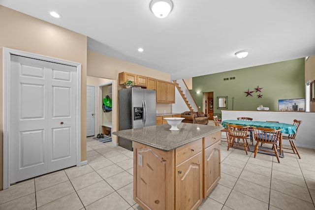 3700 Marie Meadows Dr, White Lake, MI 48383 - kitchen with a center island, light brown cabinets, light tile patterned floors, and stainless steel fridge with ice dispenser
