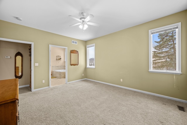 3700 Marie Meadows Dr, White Lake, MI 48383 - unfurnished bedroom featuring multiple windows, carpet floors, and baseboards