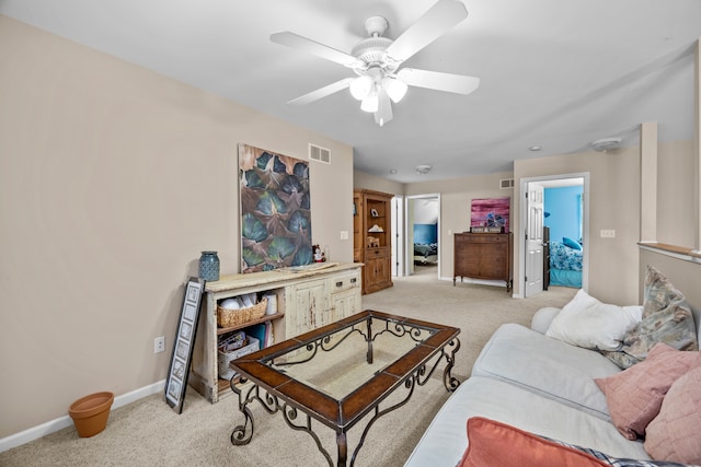 3700 Marie Meadows Dr, White Lake, MI 48383 - living area featuring light carpet, ceiling fan, and baseboards