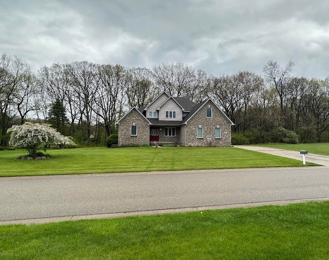 3700 Marie Meadows Dr, White Lake, MI 48383 - traditional-style home with a front yard and brick siding