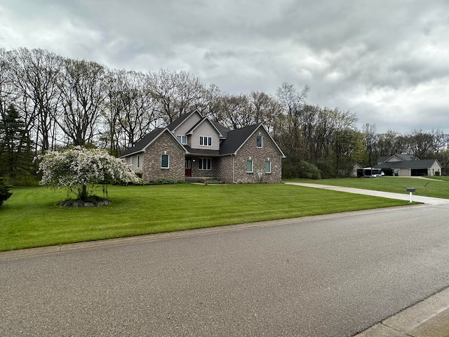 3700 Marie Meadows Dr, White Lake, MI 48383 - traditional-style house with brick siding and a front lawn