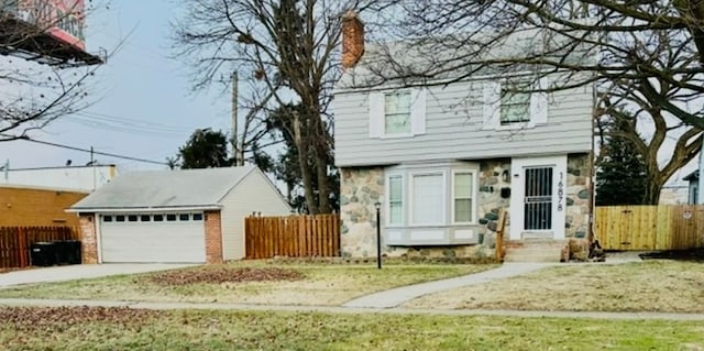 colonial-style house featuring stone siding and fence