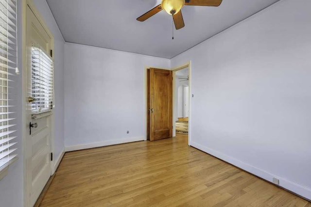 spare room featuring ceiling fan and light hardwood / wood-style floors