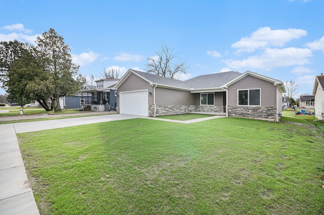 view of front of property featuring a garage and a front lawn