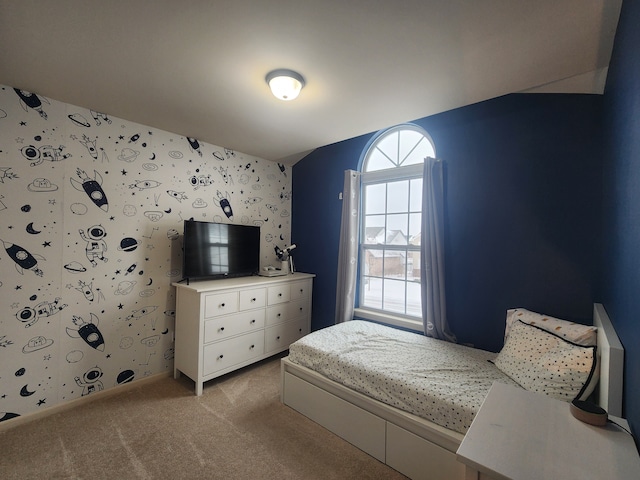 bedroom featuring light carpet