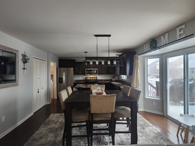 dining area with dark hardwood / wood-style floors