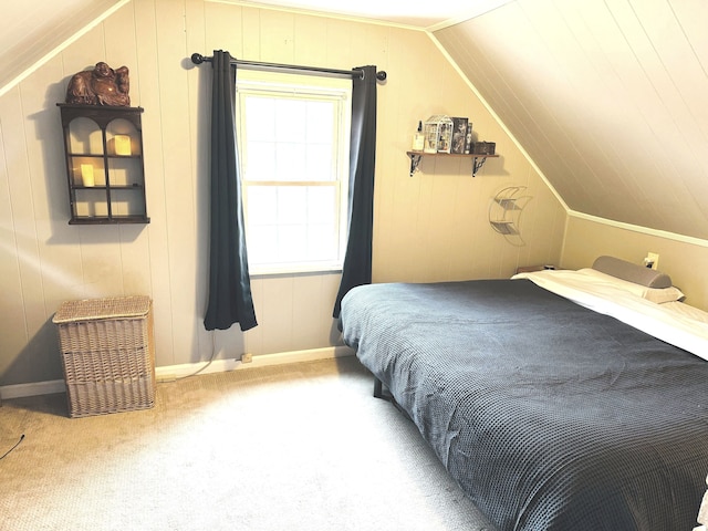 carpeted bedroom with vaulted ceiling