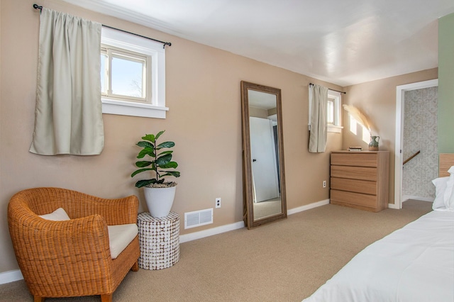 bedroom featuring light carpet