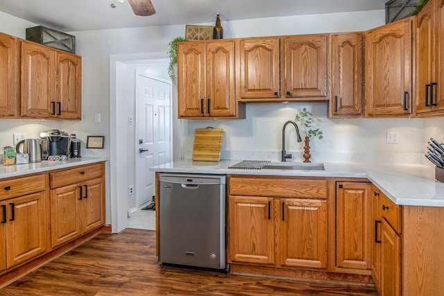 kitchen featuring dark hardwood / wood-style flooring, stainless steel dishwasher, ceiling fan, and sink