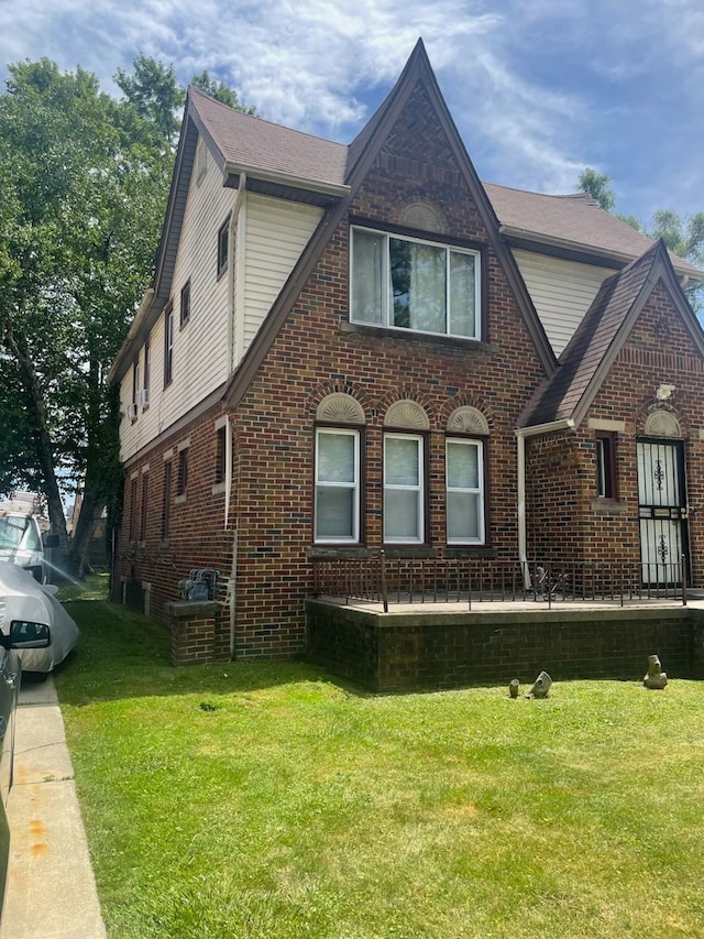 view of home's exterior with a yard