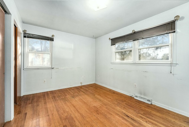 empty room featuring hardwood / wood-style flooring