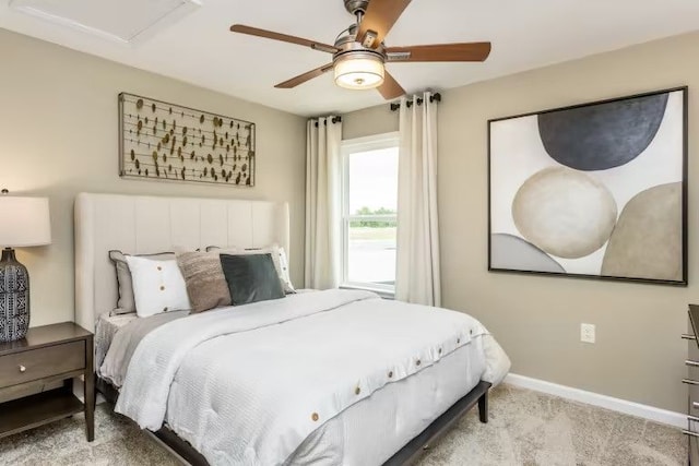 carpeted bedroom featuring ceiling fan