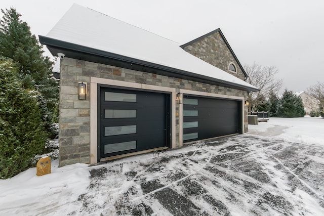 view of snow covered garage