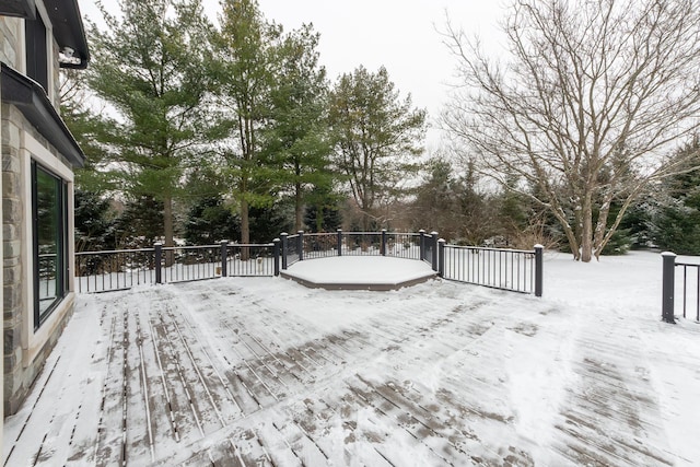 view of snow covered deck