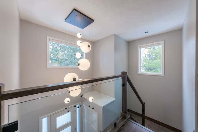 details with a textured ceiling