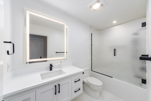 full bathroom with vanity, combined bath / shower with glass door, and toilet