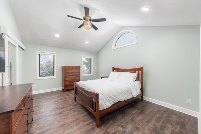 bedroom featuring lofted ceiling, dark hardwood / wood-style floors, and ceiling fan