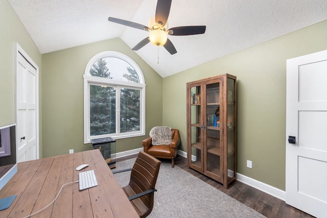 office with lofted ceiling, dark hardwood / wood-style floors, a textured ceiling, and ceiling fan