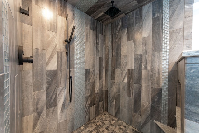 bathroom with tiled shower