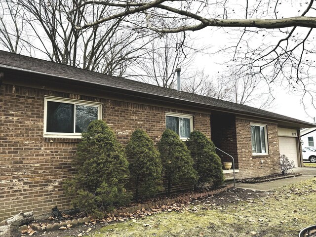 view of home's exterior with a garage