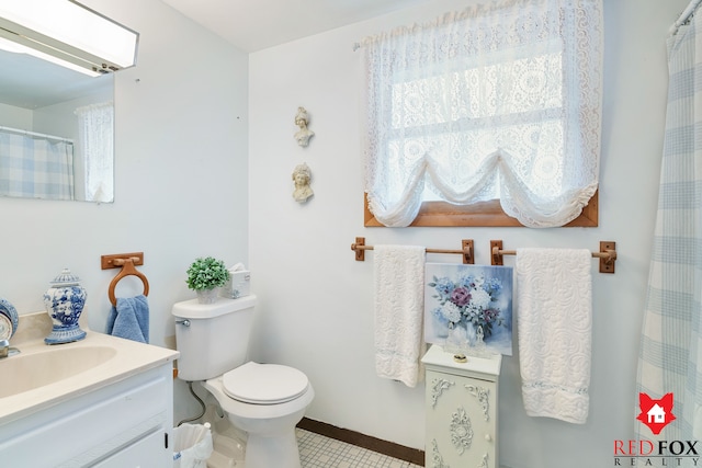 bathroom featuring vanity and toilet