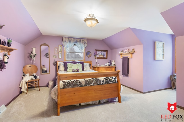 bedroom featuring light carpet and vaulted ceiling