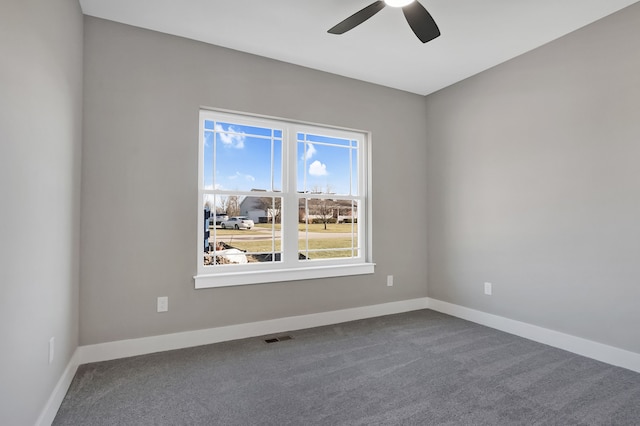 unfurnished room with carpet floors and ceiling fan