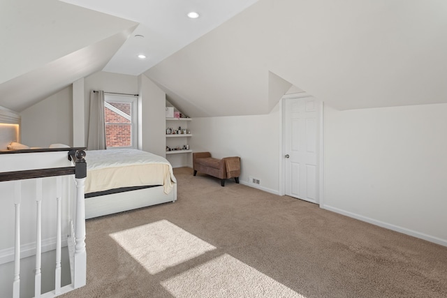 carpeted bedroom featuring lofted ceiling