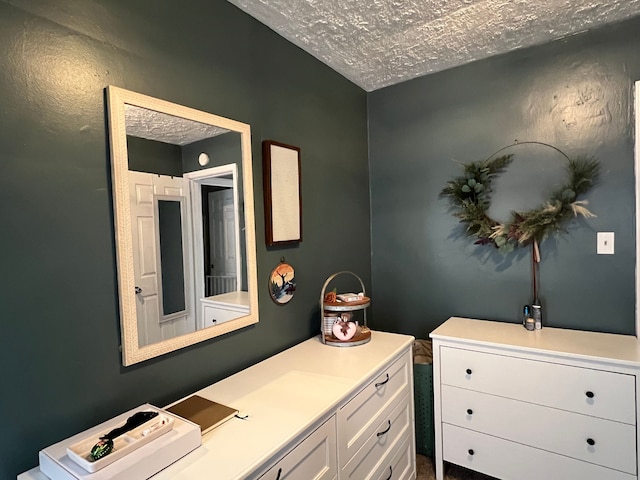 bathroom with a textured ceiling