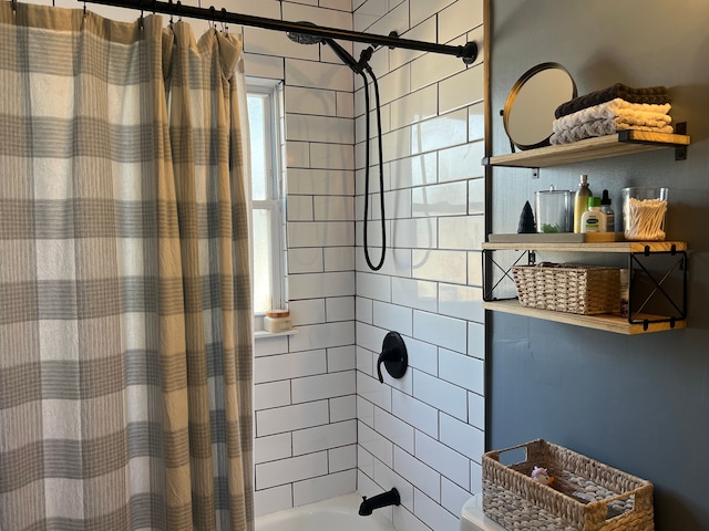 bathroom with shower / bathtub combination with curtain