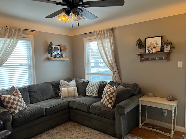 living room with hardwood / wood-style flooring, a wealth of natural light, and ceiling fan