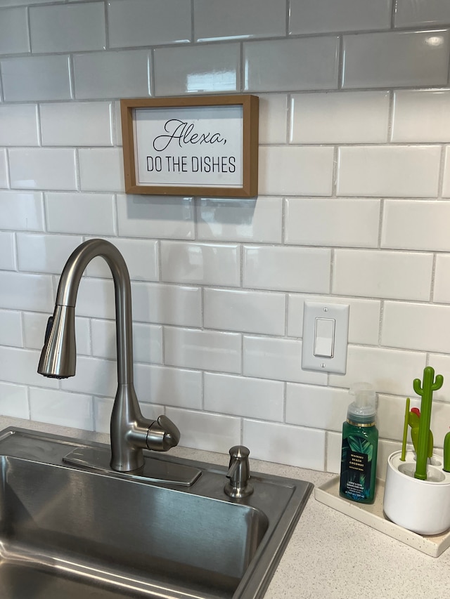 room details with backsplash and sink