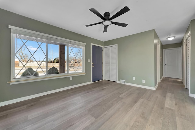 interior space featuring ceiling fan and light hardwood / wood-style flooring