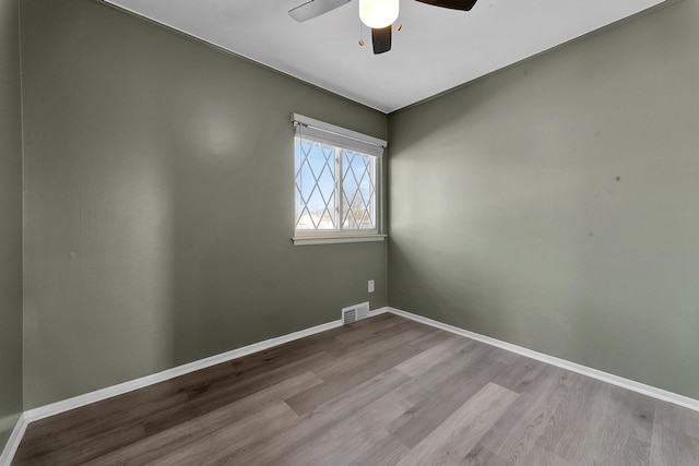 unfurnished room featuring ceiling fan and light wood-type flooring