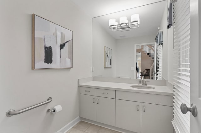 bathroom with tile patterned flooring and vanity