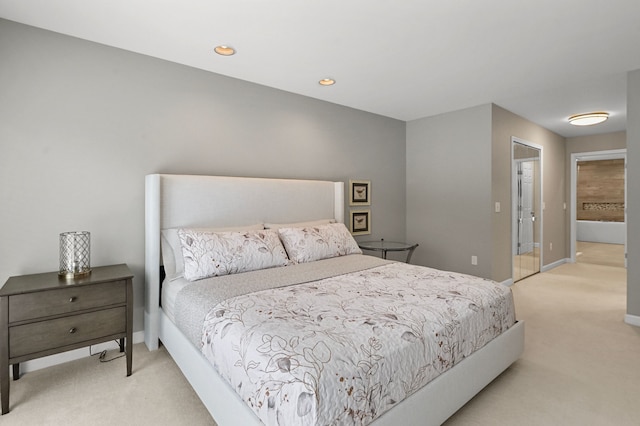 bedroom featuring light colored carpet