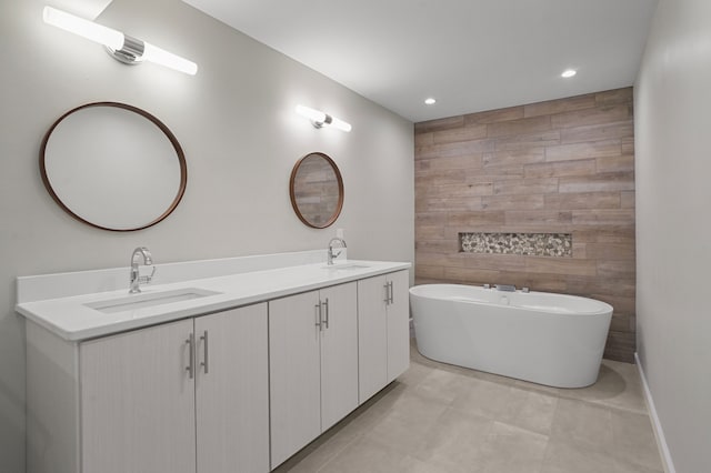 bathroom with vanity and a tub to relax in