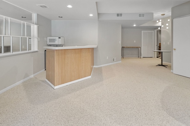 kitchen with light colored carpet