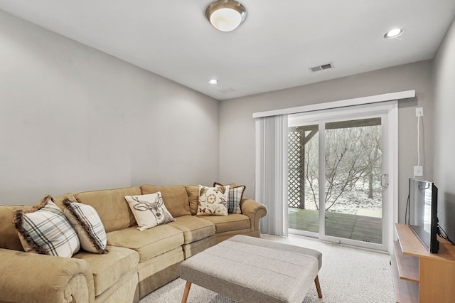 living room featuring light carpet