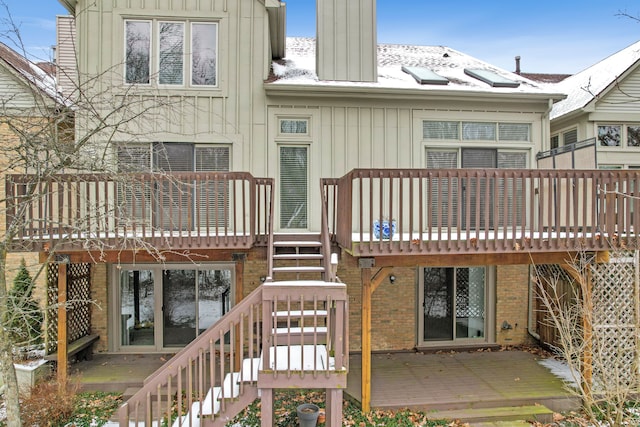 rear view of property with a wooden deck