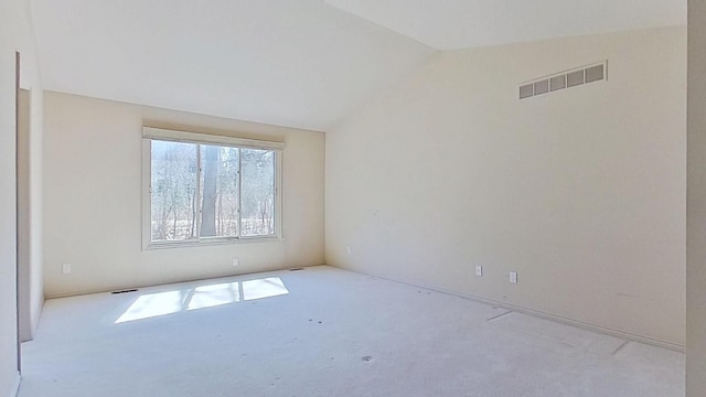 5059 Pheasant Cv, West Bloomfield, MI 48323 - empty room with vaulted ceiling, visible vents, and carpet floors