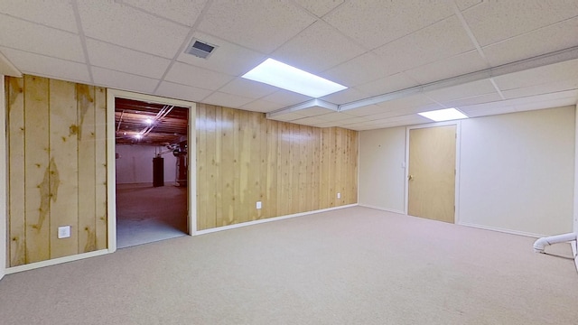 5059 Pheasant Cv, West Bloomfield, MI 48323 - finished basement featuring carpet flooring, a drop ceiling, visible vents, and wood walls
