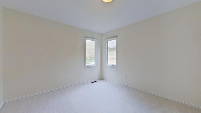 5059 Pheasant Cv, West Bloomfield, MI 48323 - carpeted spare room featuring visible vents and baseboards