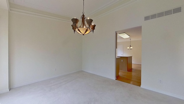 5059 Pheasant Cv, West Bloomfield, MI 48323 - spare room featuring an inviting chandelier, light carpet, visible vents, and ornamental molding