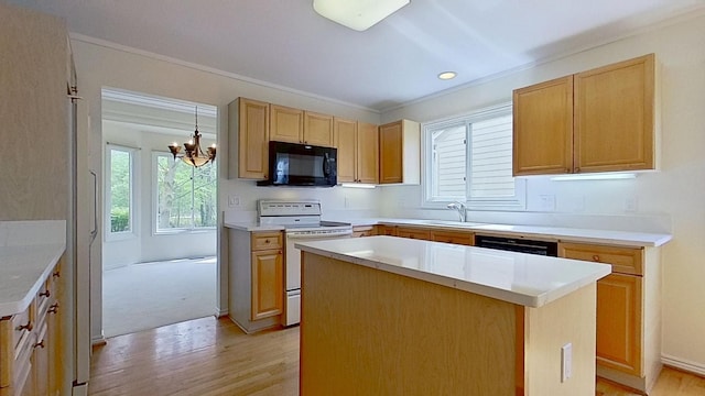 5059 Pheasant Cv, West Bloomfield, MI 48323 - kitchen with a sink, black appliances, an inviting chandelier, light wood-style flooring, and a kitchen island