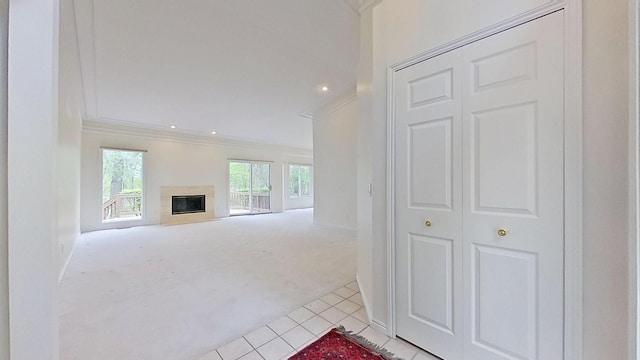 5059 Pheasant Cv, West Bloomfield, MI 48323 - unfurnished living room featuring light tile patterned floors, crown molding, a glass covered fireplace, light carpet, and recessed lighting