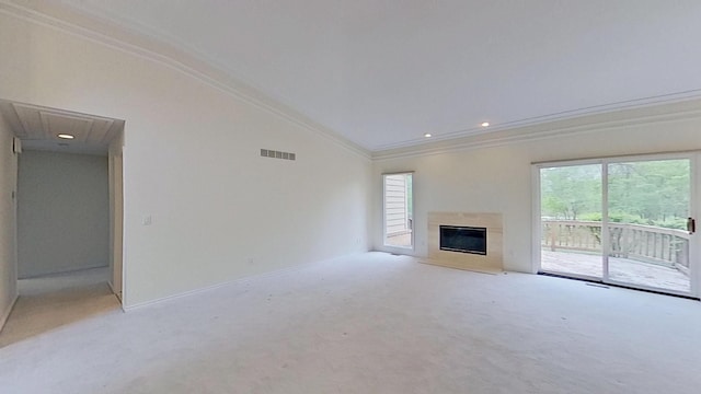 5059 Pheasant Cv, West Bloomfield, MI 48323 - unfurnished living room featuring lofted ceiling, attic access, ornamental molding, visible vents, and light carpet