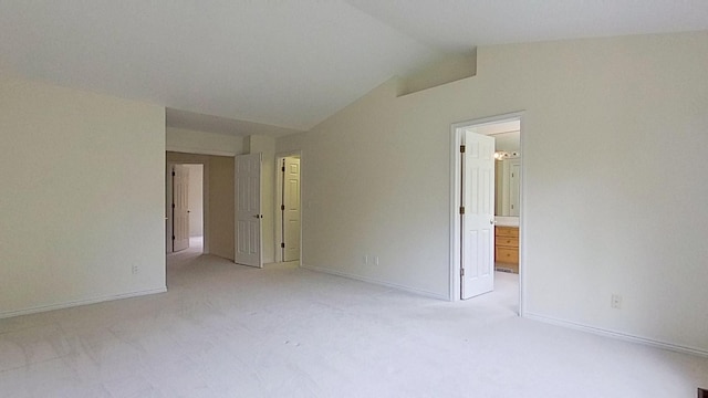 5059 Pheasant Cv, West Bloomfield, MI 48323 - empty room featuring vaulted ceiling, light carpet, and baseboards