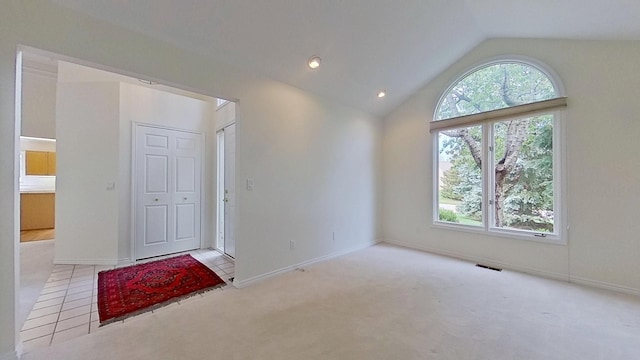 5059 Pheasant Cv, West Bloomfield, MI 48323 - empty room with baseboards, a healthy amount of sunlight, carpet, and vaulted ceiling